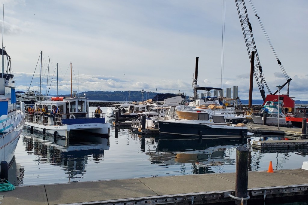 A 40' boat approaches the dock in a marina
